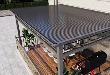 Roof terrace cover with decorative frieze over a timber deck